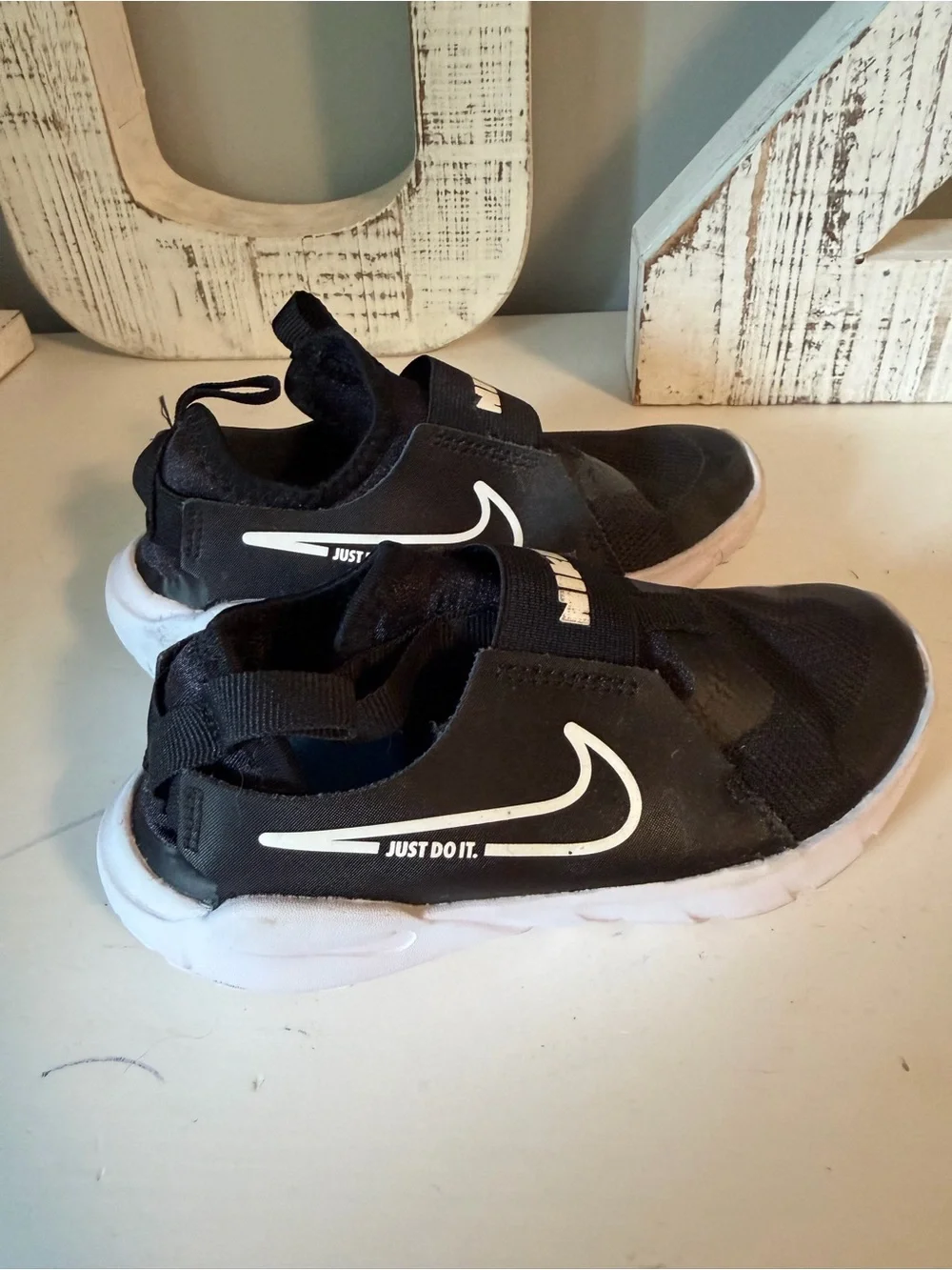Nike Kids Black and White Slip-On Sneakers